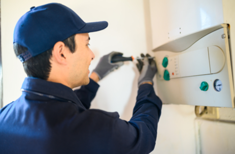 technician working on a tankless water heater